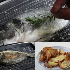 Dorada z grilla, doprawiona rozmarynem, czeka na podanie z chrupiącymi ziemniakami.